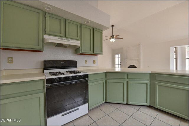 kitchen with vaulted ceiling, light tile patterned floors, green cabinets, ceiling fan, and gas range gas stove