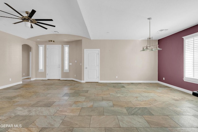 unfurnished room featuring ceiling fan and vaulted ceiling