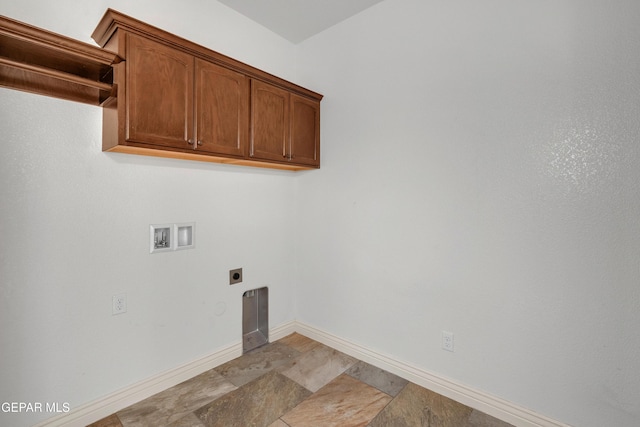 laundry room featuring electric dryer hookup, cabinets, and hookup for a washing machine