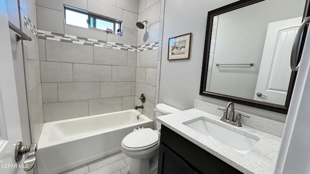 full bathroom with tile patterned flooring, toilet, vanity, and tiled shower / bath