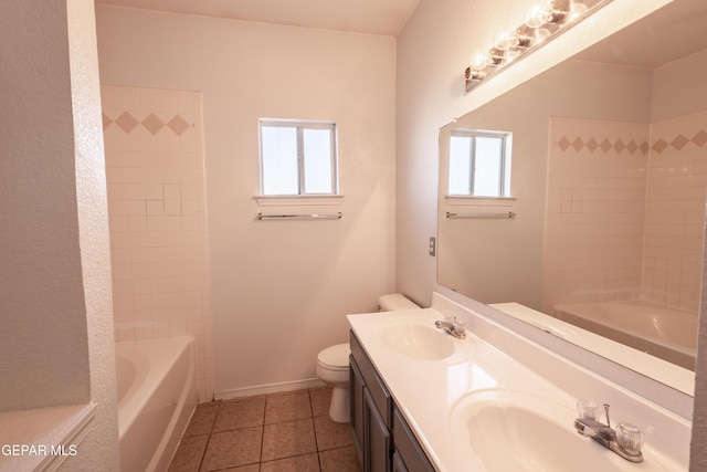 full bathroom featuring tile patterned flooring, vanity, toilet, and a wealth of natural light