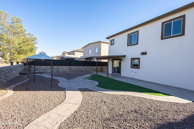 view of yard featuring a gazebo and a patio area