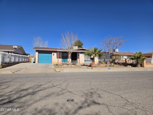 single story home featuring a garage