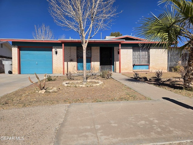 ranch-style home featuring a garage