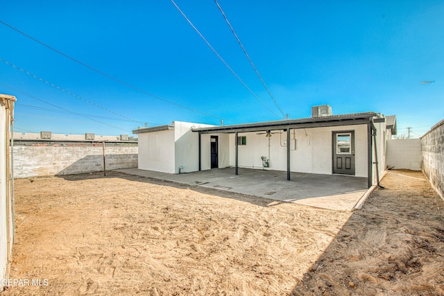 rear view of property with a patio and central AC unit