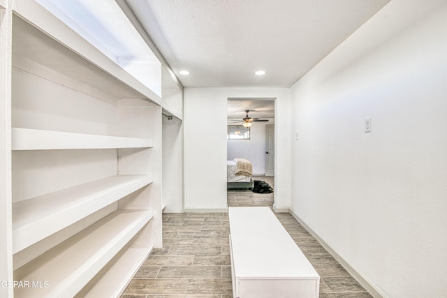 spacious closet featuring ceiling fan