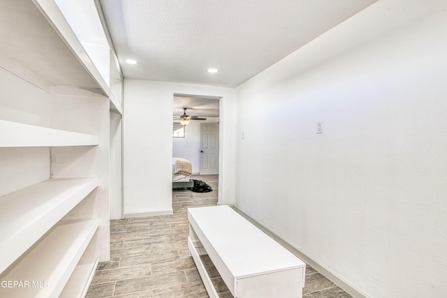 spacious closet featuring ceiling fan