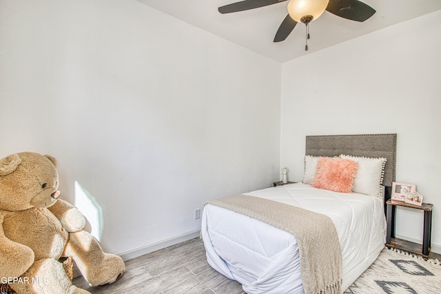 bedroom featuring ceiling fan and light hardwood / wood-style flooring