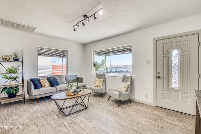 living room featuring a textured ceiling