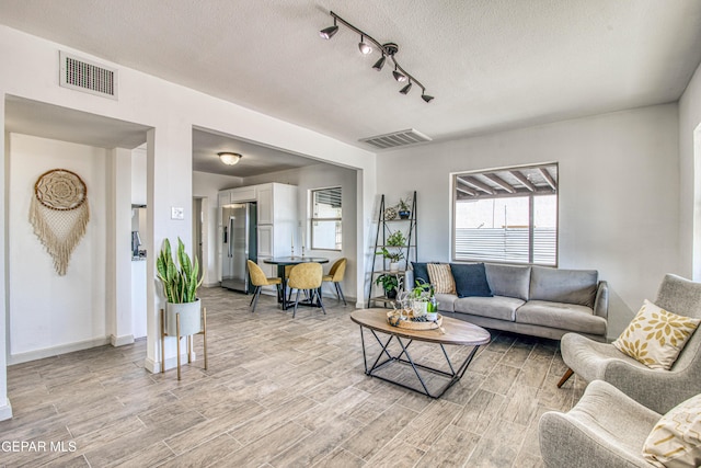 living room with a textured ceiling