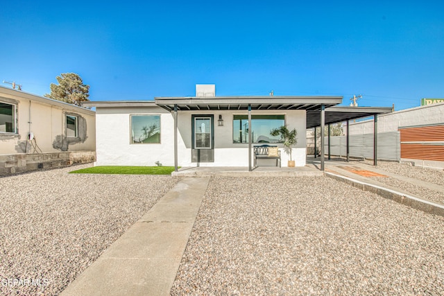 rear view of property featuring a patio