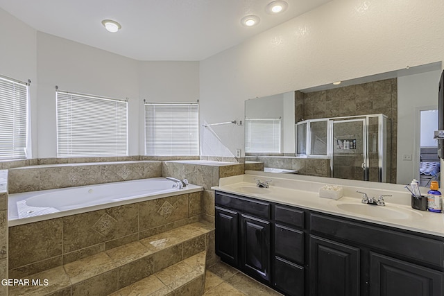 bathroom with plus walk in shower and vanity