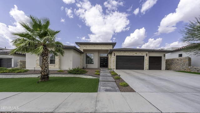 view of front of house featuring a front yard and a garage