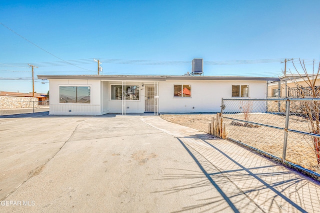 ranch-style house featuring central AC unit