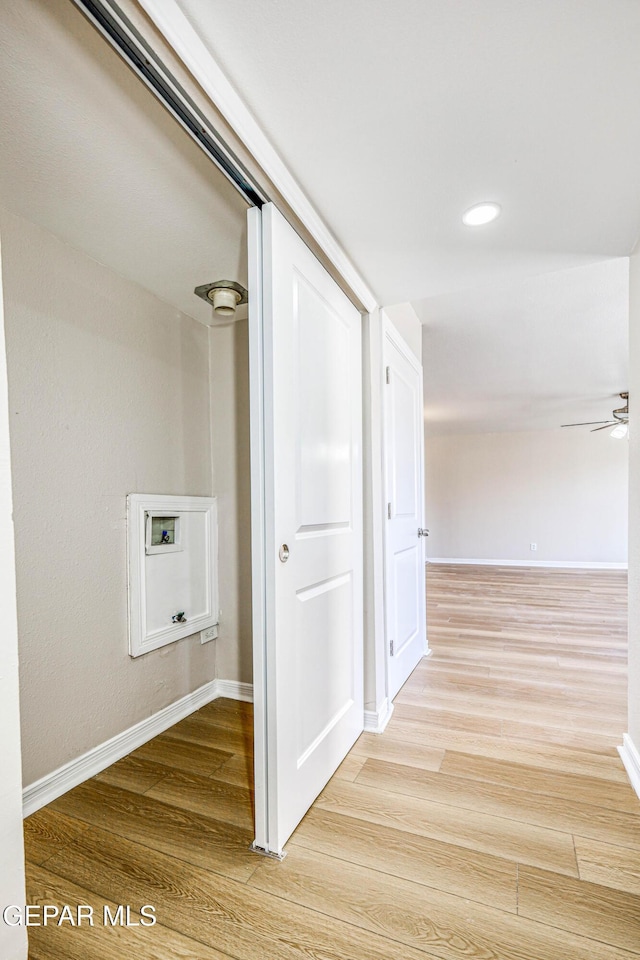 corridor featuring hardwood / wood-style floors