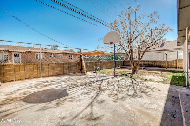 view of patio with basketball court