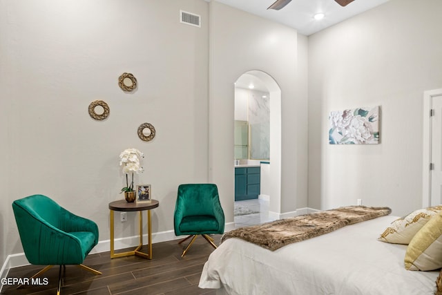 bedroom featuring connected bathroom and ceiling fan