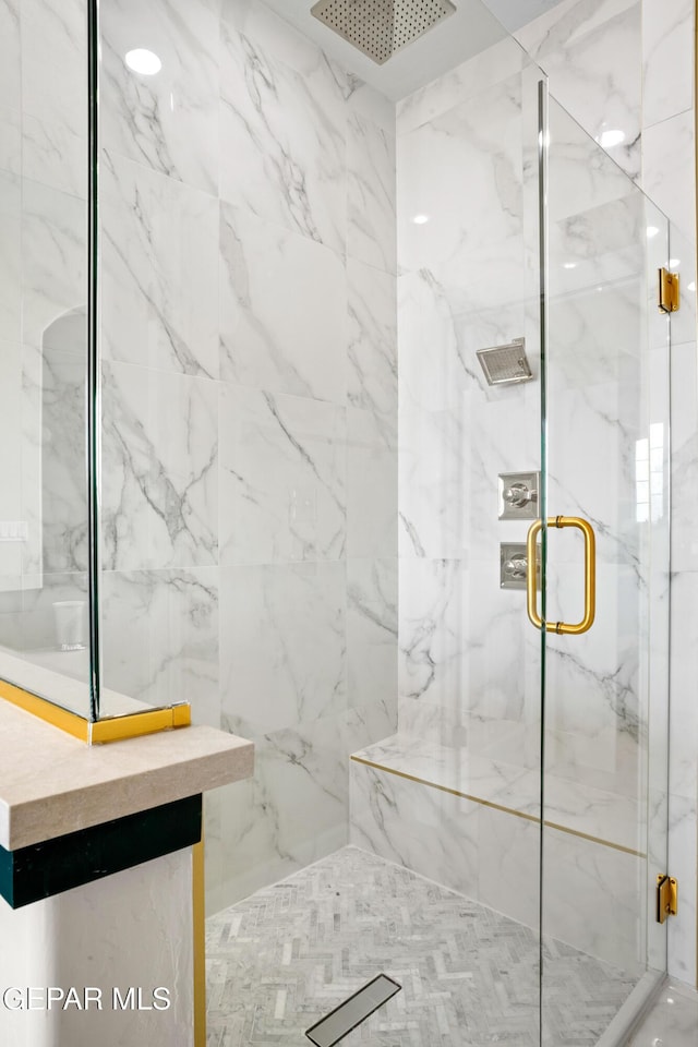 bathroom featuring an enclosed shower