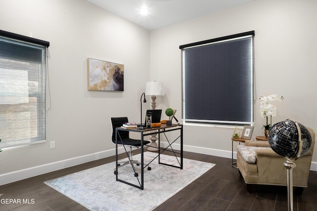 office with dark wood-type flooring