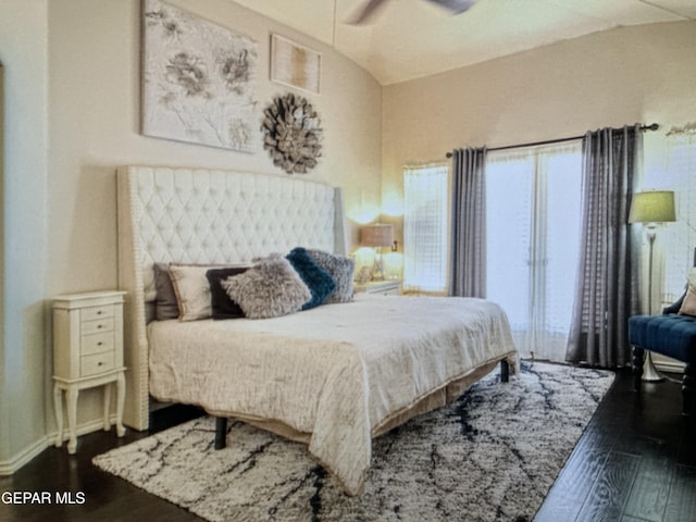 bedroom featuring ceiling fan and dark hardwood / wood-style flooring