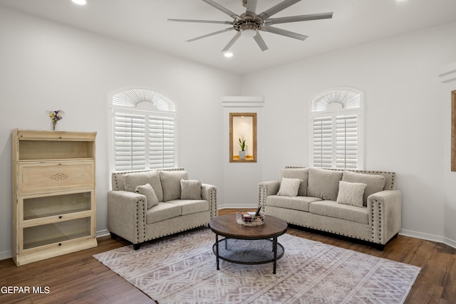 living room with ceiling fan, dark hardwood / wood-style flooring, and plenty of natural light