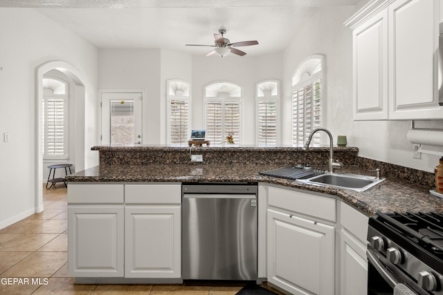 kitchen featuring sink, white cabinets, and a healthy amount of sunlight