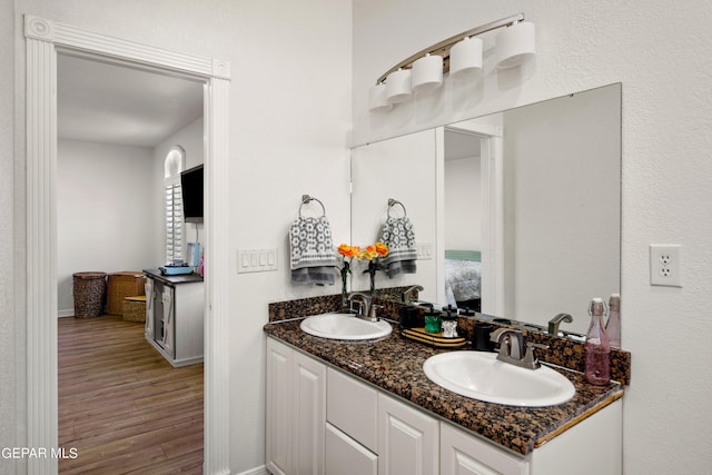 bathroom featuring hardwood / wood-style floors and vanity