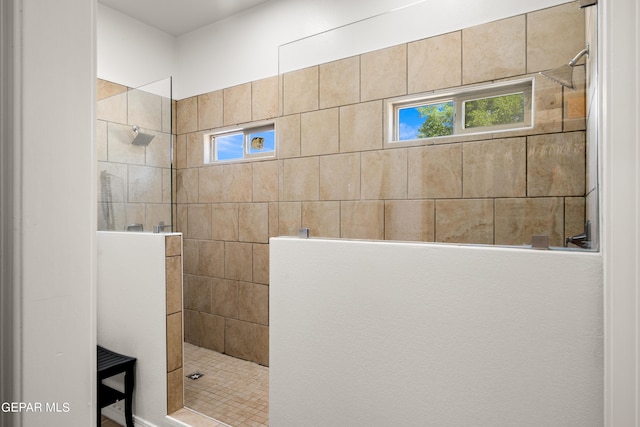 bathroom featuring a tile shower