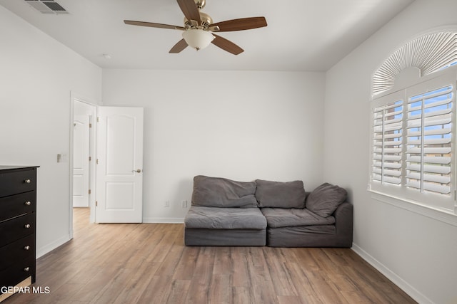 sitting room featuring ceiling fan and light hardwood / wood-style flooring