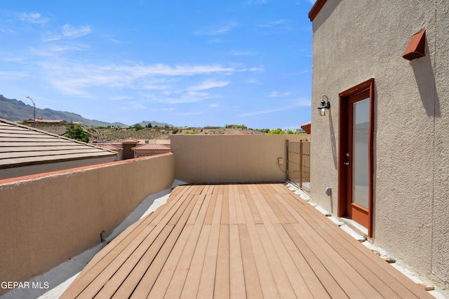 wooden deck with a mountain view