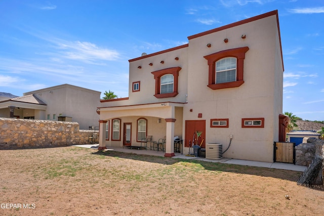 back of property featuring a patio and central air condition unit