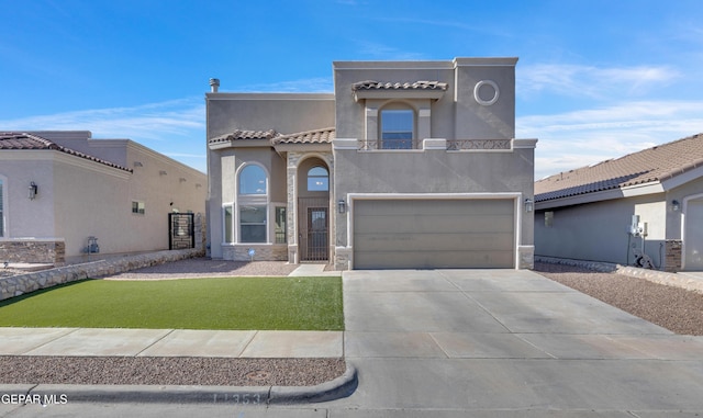 view of front of home featuring a front yard and a garage