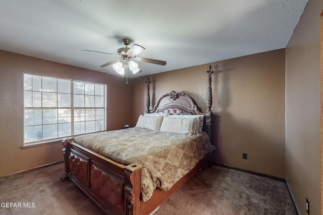 bedroom with carpet flooring, a textured ceiling, and ceiling fan