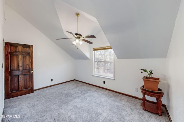 bonus room with lofted ceiling, light carpet, and ceiling fan