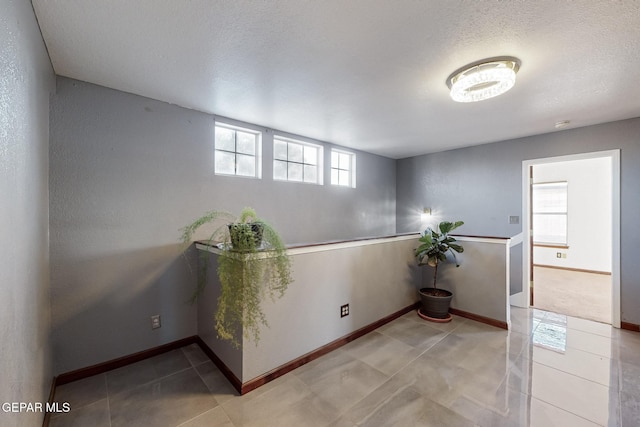 interior space with a textured ceiling