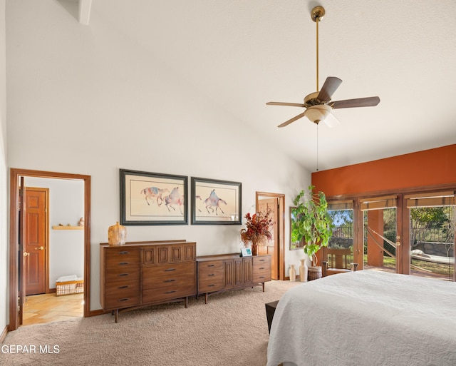 bedroom featuring high vaulted ceiling, light carpet, and ceiling fan