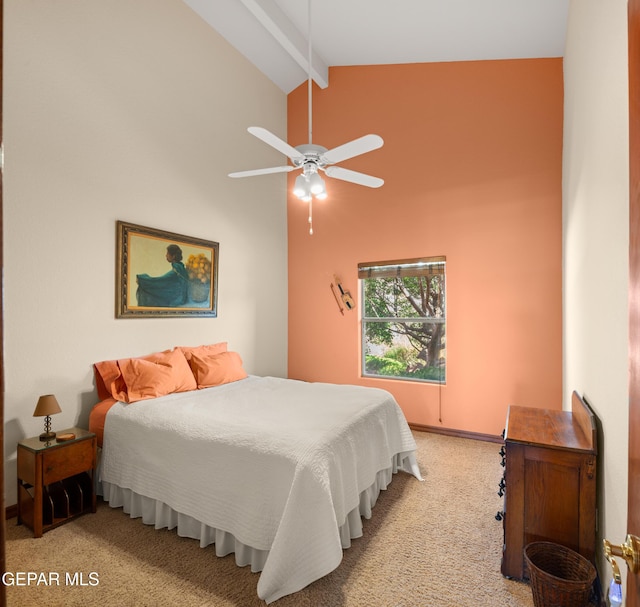 bedroom featuring light colored carpet, ceiling fan, and vaulted ceiling with beams