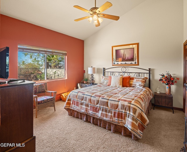 carpeted bedroom featuring ceiling fan and vaulted ceiling