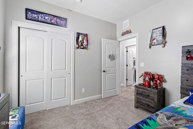 carpeted bedroom featuring a closet