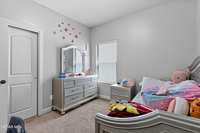 bedroom featuring light colored carpet