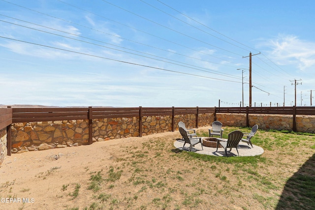 view of yard featuring a patio area and a fire pit