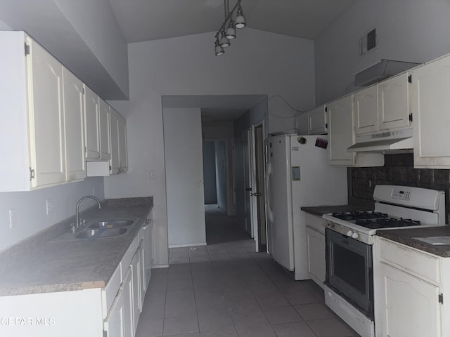 kitchen with sink, white appliances, backsplash, white cabinets, and light tile patterned flooring