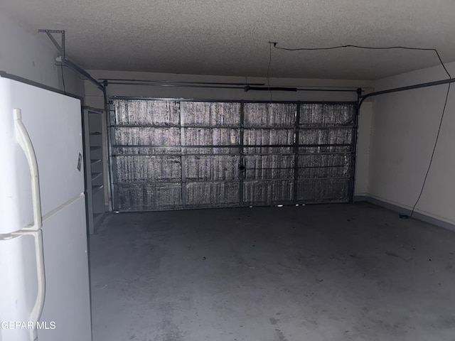 garage featuring white fridge