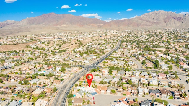 birds eye view of property with a mountain view