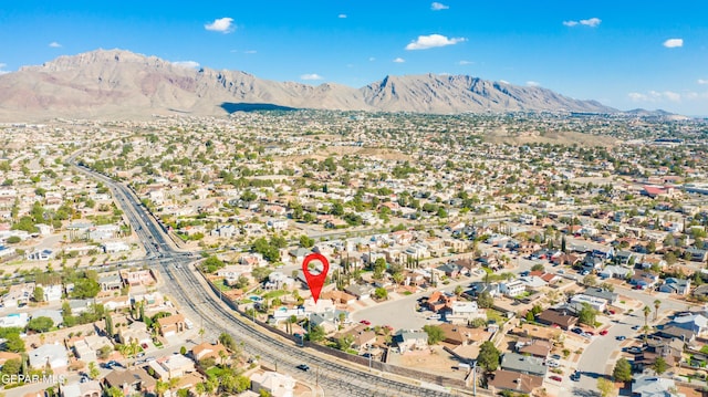 birds eye view of property featuring a mountain view