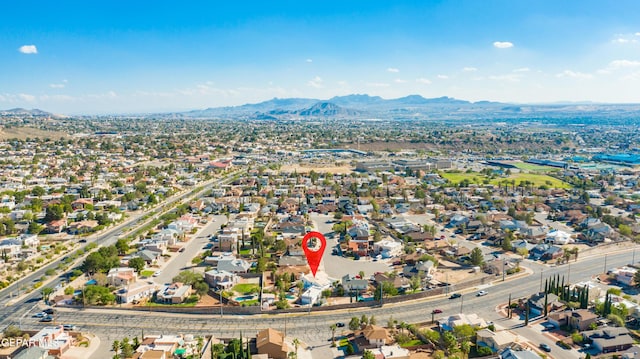 birds eye view of property featuring a mountain view