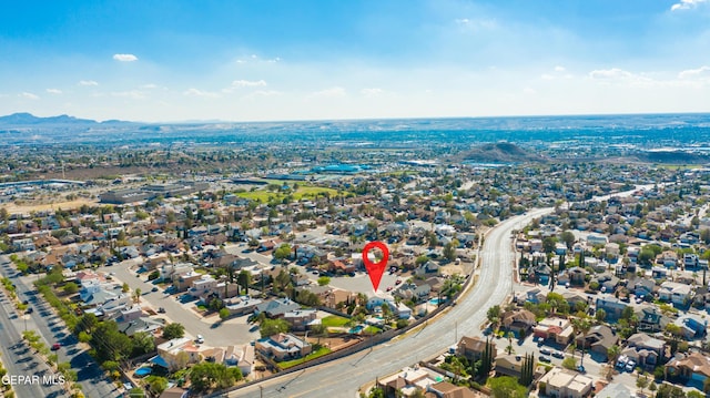 birds eye view of property with a mountain view