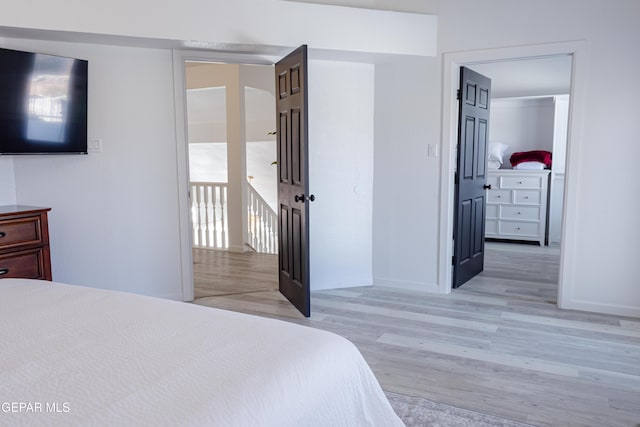 bedroom featuring light wood-type flooring