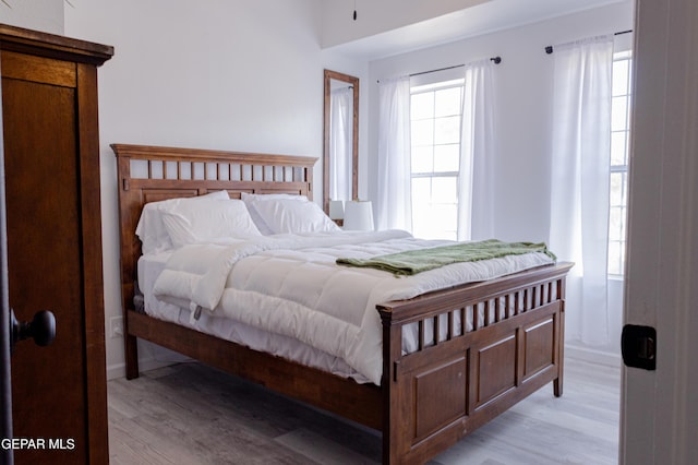 bedroom with light wood-type flooring