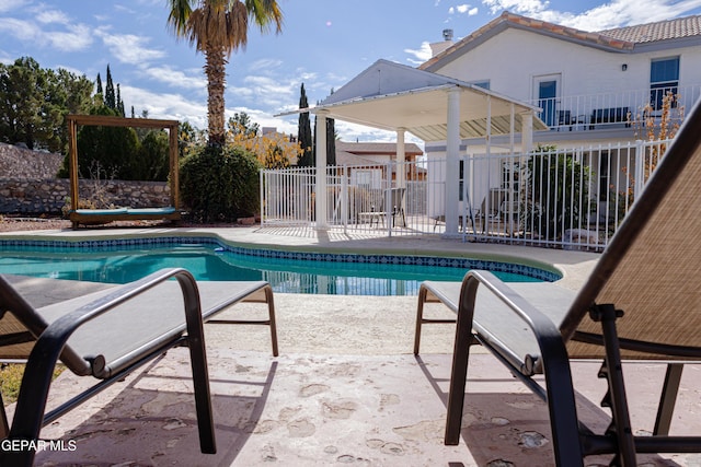 view of swimming pool with a patio area